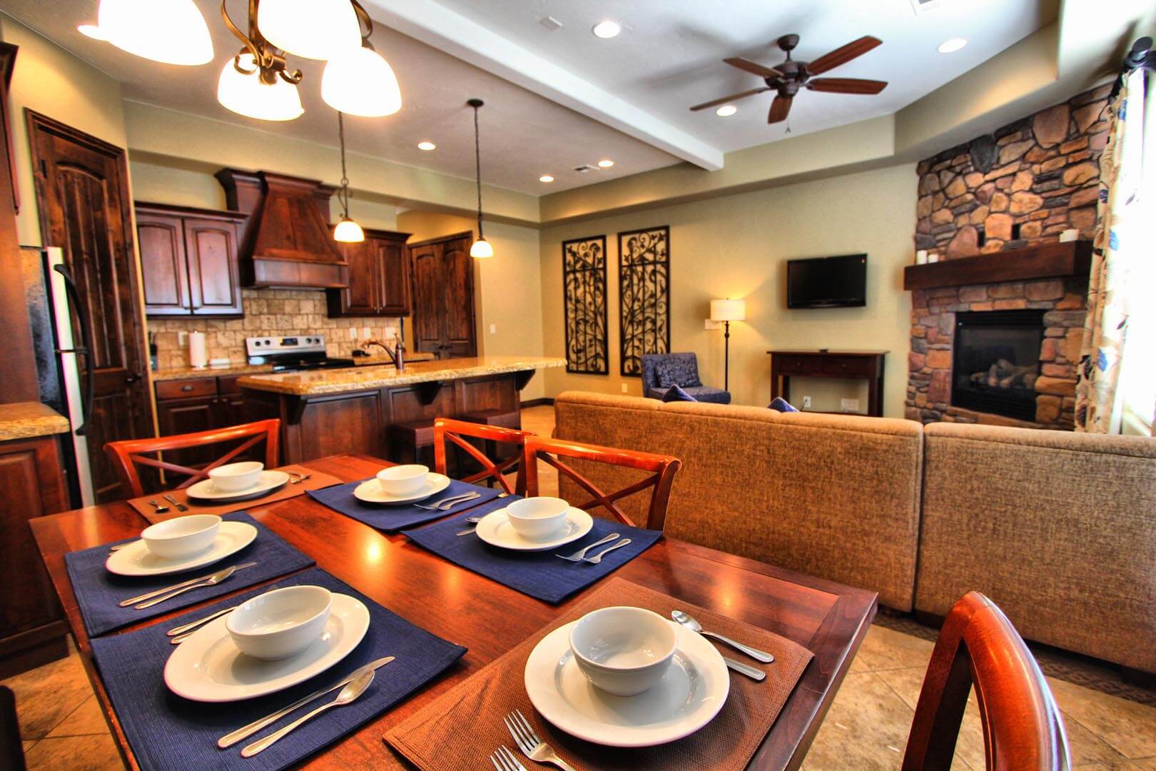 A family sized condominiums with a dining table and living room at VRI's Canyon Villas at Coral Ridge in Washington, Utah.